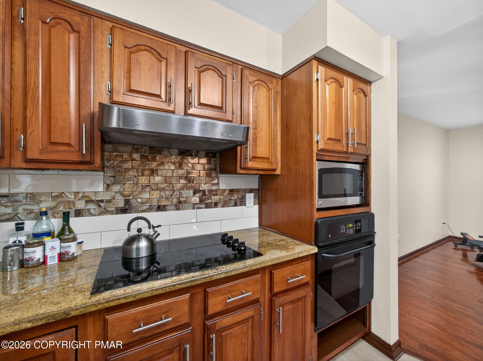 363 Blue Ridge Road Saylorsburg, PA 18353 - Photo 28 of 61 a kitchen with stainless steel appliances granite countertop a sink stove and cabinets