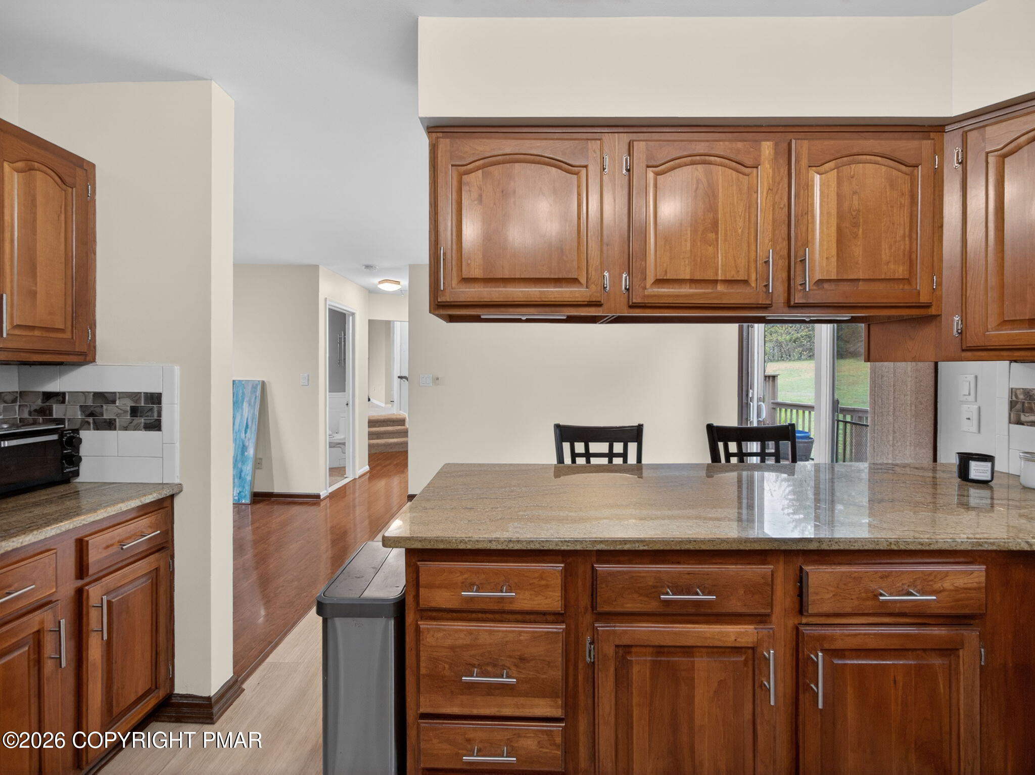 363 Blue Ridge Road Saylorsburg, PA 18353 - Photo 30 of 61 a kitchen with stainless steel appliances granite countertop a refrigerator a sink and wooden cabinets
