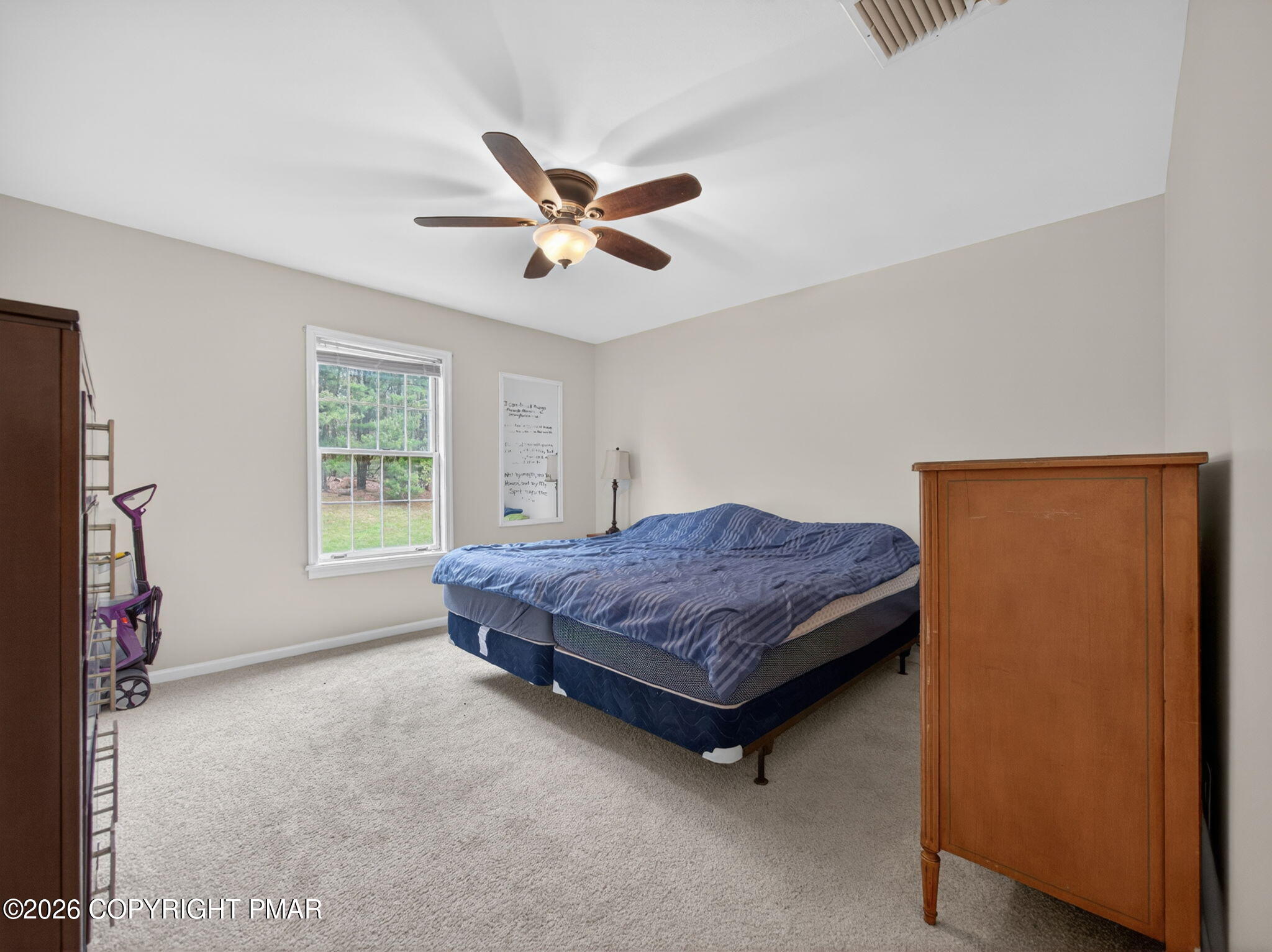 363 Blue Ridge Road Saylorsburg, PA 18353 - Photo 43 of 61 a living room with a bed furniture and a window