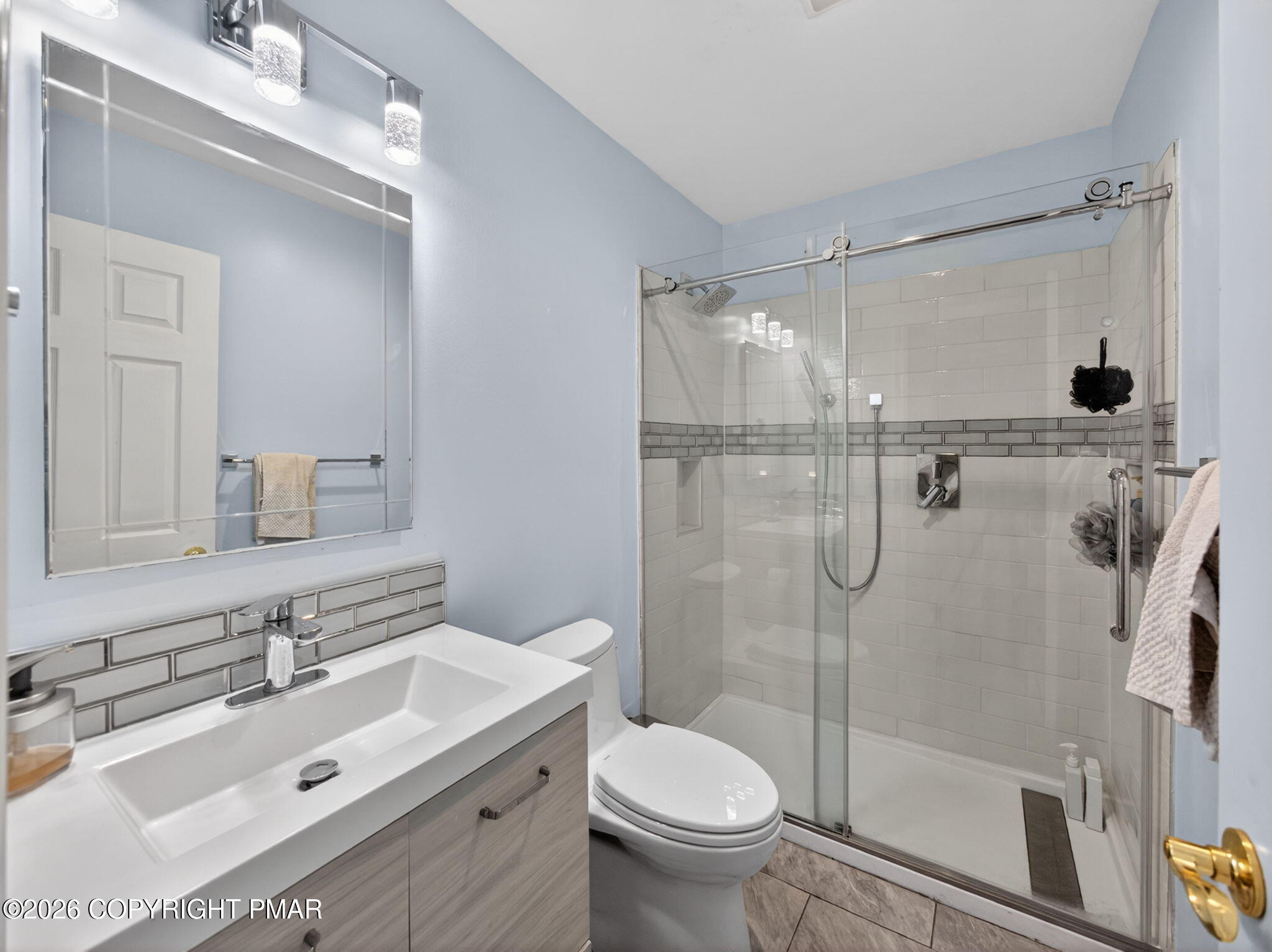 363 Blue Ridge Road Saylorsburg, PA 18353 - Photo 44 of 61 a bathroom with a sink mirror toilet and shower