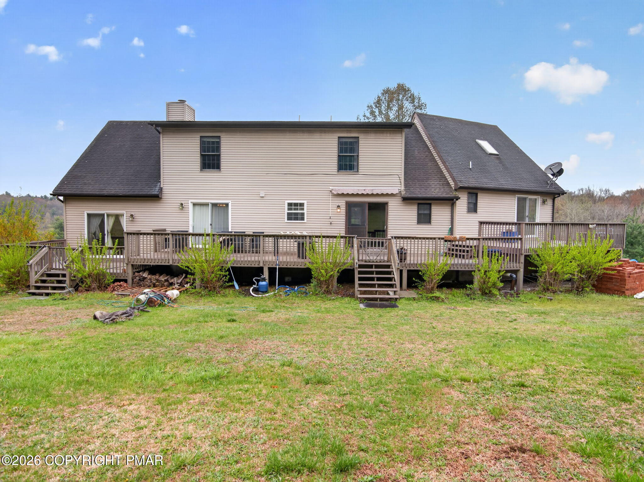 363 Blue Ridge Road Saylorsburg, PA 18353 - Photo 55 of 61 a view of a house with backyard sitting area and swimming pool