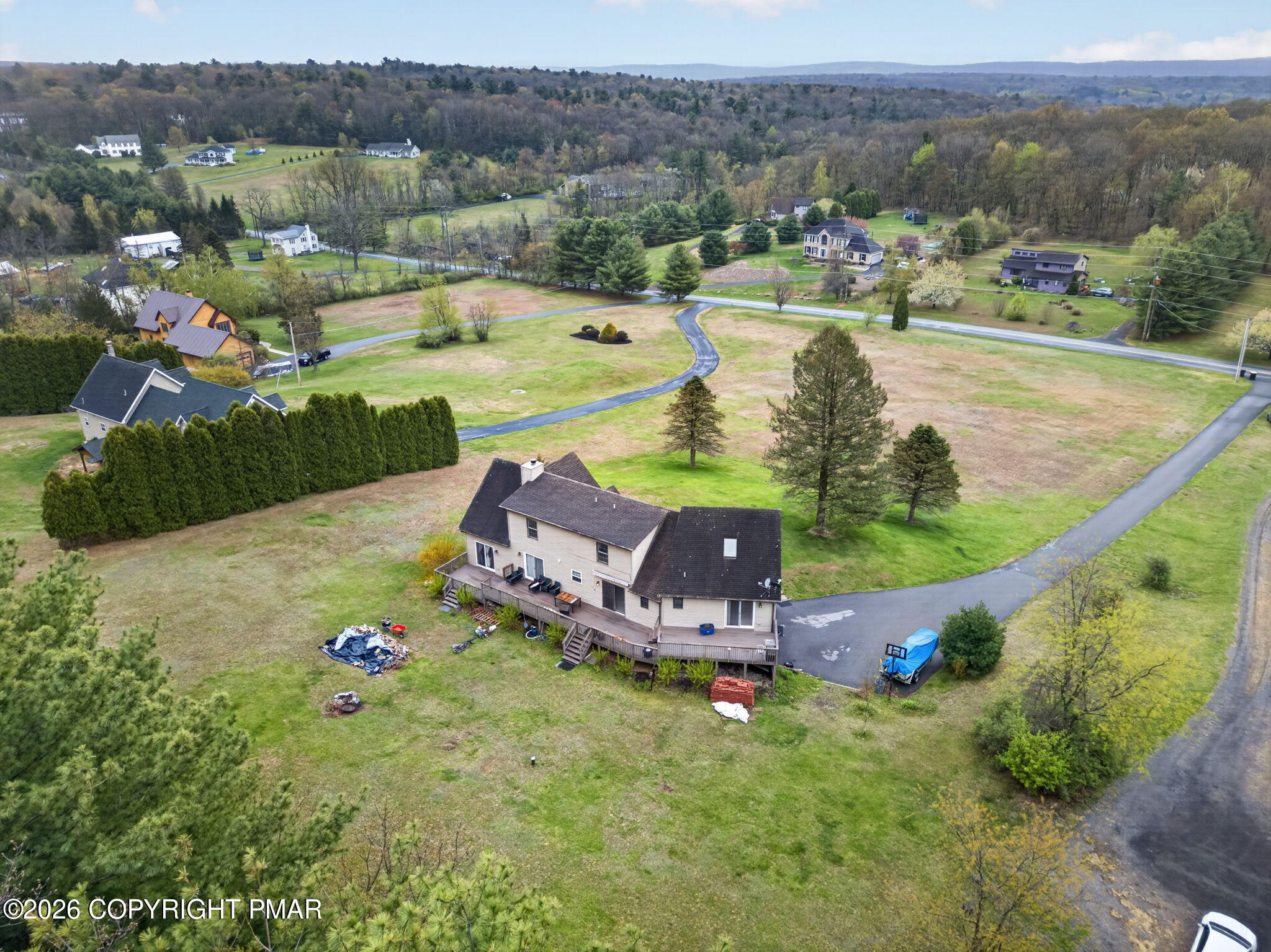 363 Blue Ridge Road Saylorsburg, PA 18353 - Photo 59 of 61 an aerial view of a house with a garden and lake view