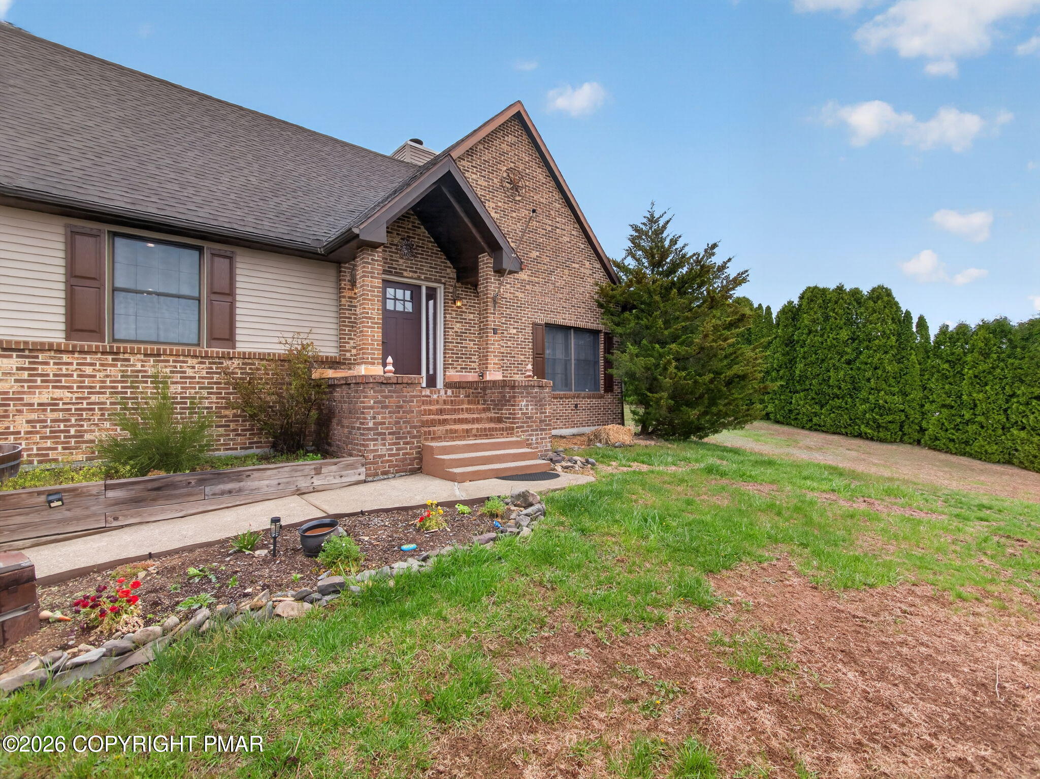 363 Blue Ridge Road Saylorsburg, PA 18353 - Photo 7 of 61 a front view of a house with garden