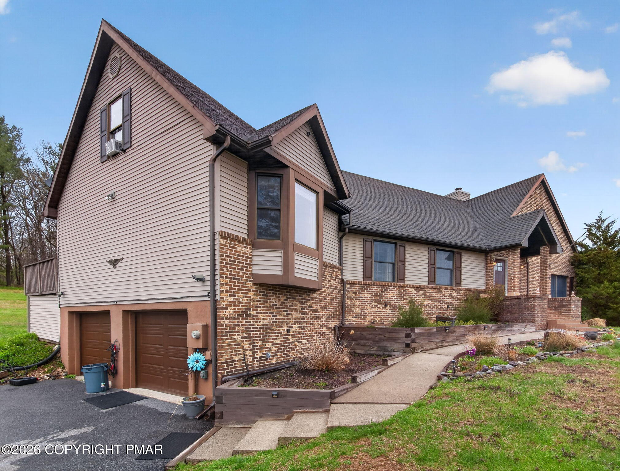 363 Blue Ridge Road Saylorsburg, PA 18353 - Photo 8 of 61 a front view of a house with a yard
