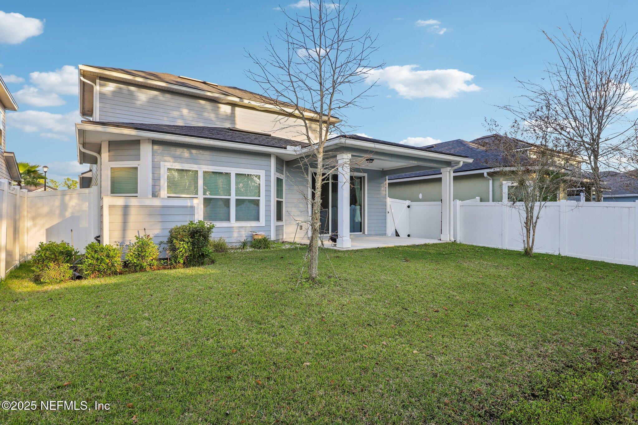 2171 Eagle Talon Circle Fleming Island, FL 32003 - Photo 39 of 44 a view of a house with backyard and garden