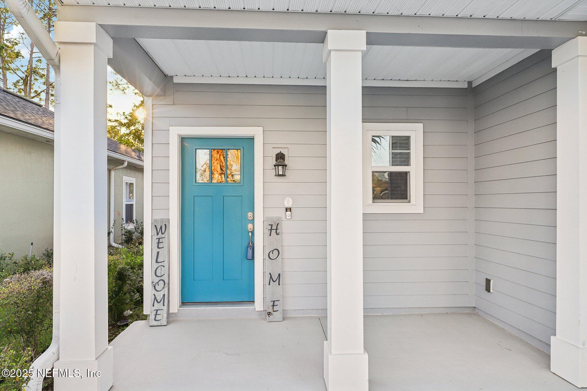 2171 Eagle Talon Circle Fleming Island, FL 32003 - Photo 4 of 44 front view of a brick house with a glass door