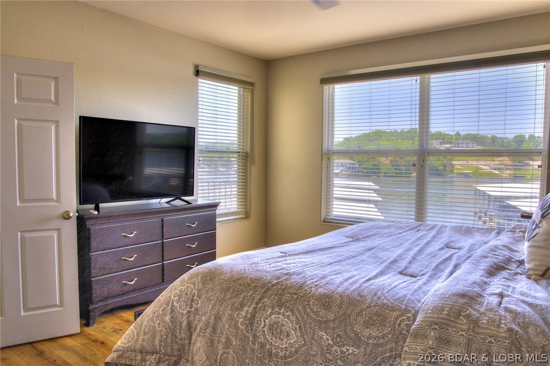 275 Flynn Road, Unit 106 Lake Ozark, MO 65049 - Photo 9 of 39 The main level en suite features multiple windows.