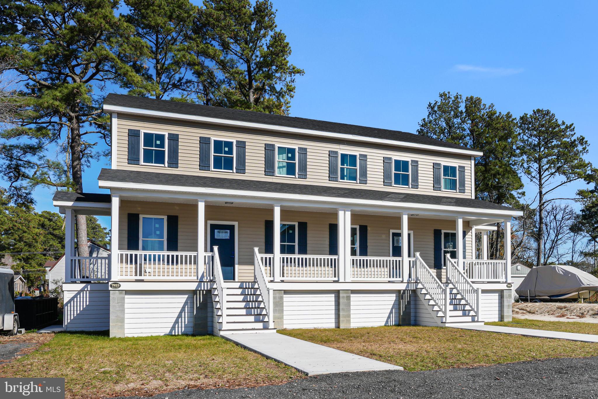 7923 East Side Road Chincoteague Island, VA 23336 - Photo 1 of 5 a front view of a house with a yard