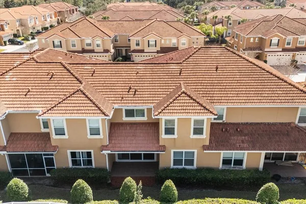 an aerial view of residential houses with outdoor space