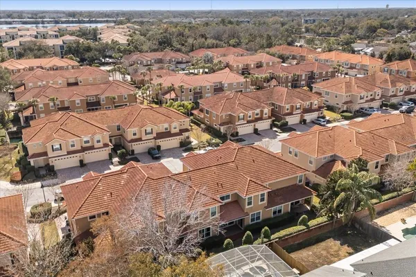 an aerial view of residential houses with outdoor space