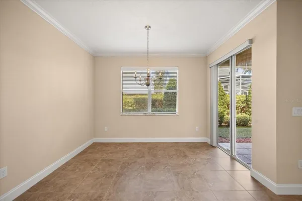 a view of an empty room with windows