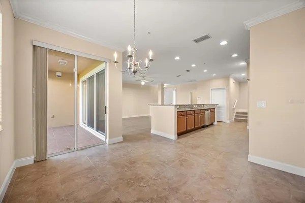 a view of a kitchen with a sink and cabinets