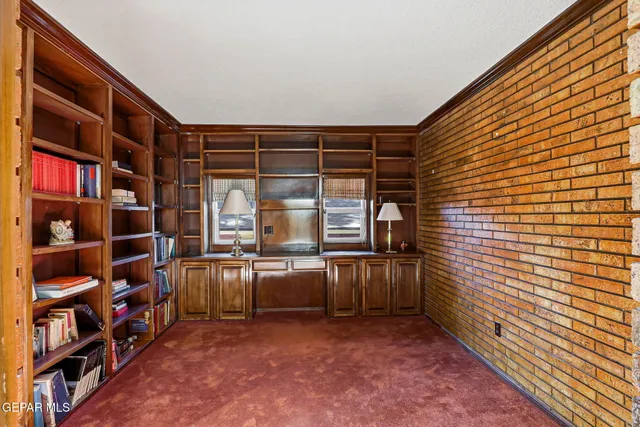 a view of bedroom with a baby bed