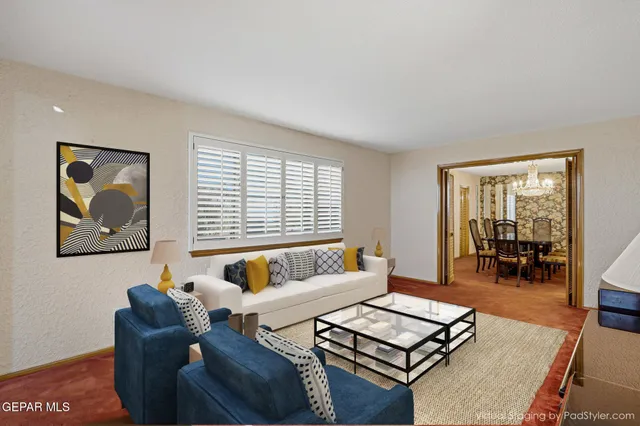 a room with chandelier cabinet and windows