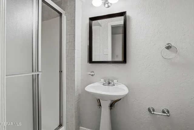 an aerial view of a house with a swimming pool