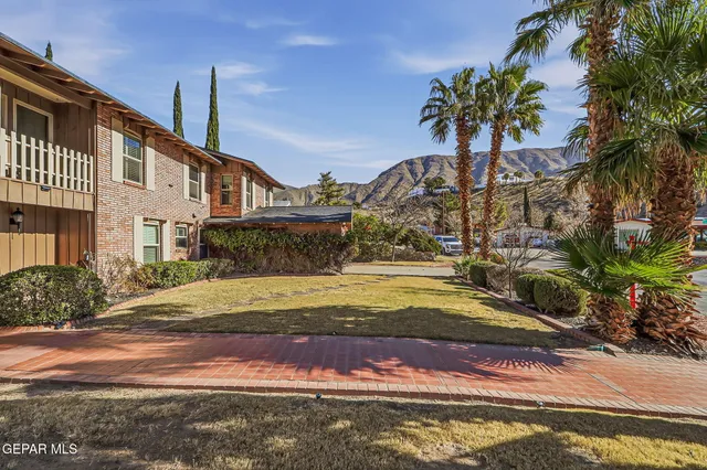 a living room with furniture and a book shelf
