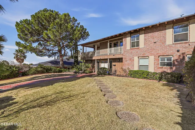 a kitchen with a sink stove top oven and microwave