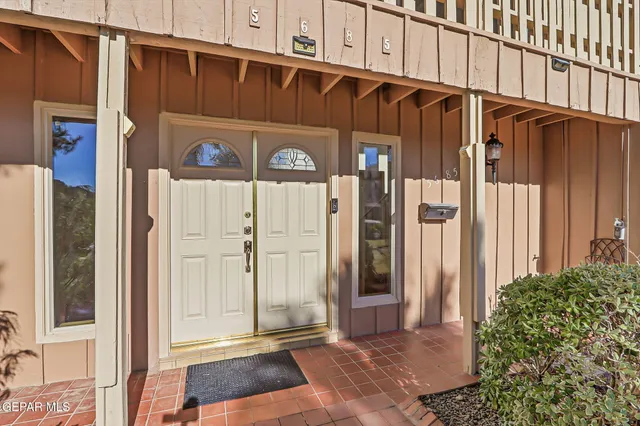 a kitchen with granite countertop cabinets stainless steel appliances a sink and a window
