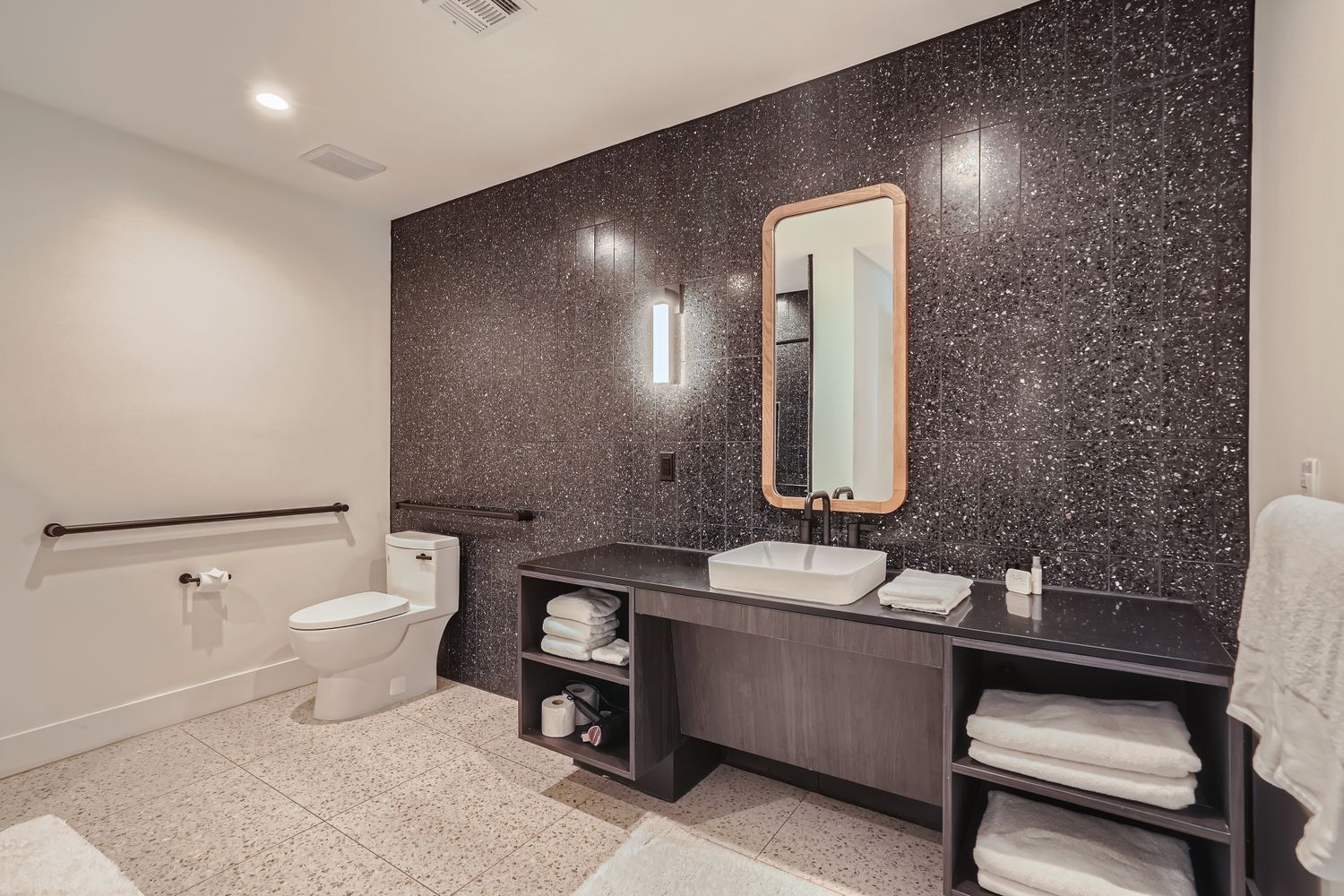 48 East Avenue, Unit 1706 Austin, TX 78701 - Photo 6 of 12 a bathroom with a toilet sink and mirror