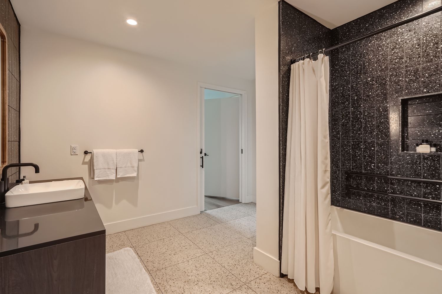 48 East Avenue, Unit 1706 Austin, TX 78701 - Photo 7 of 12 a bathroom with a sink and a tub
