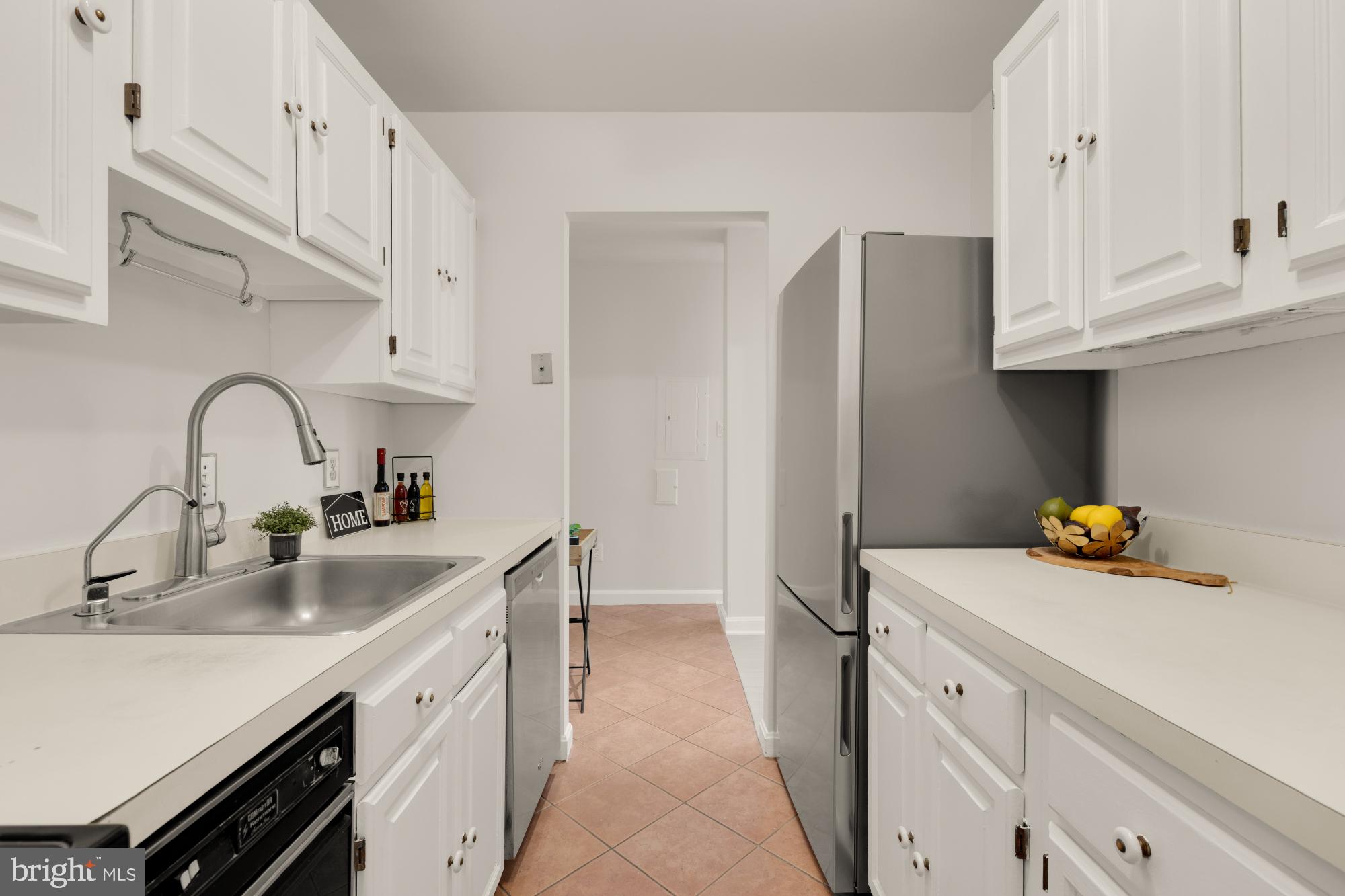 2000 16th Street Northwest, Unit 6 Washington, DC 20009 - Photo 20 of 37 a kitchen with stainless steel appliances a sink and cabinets