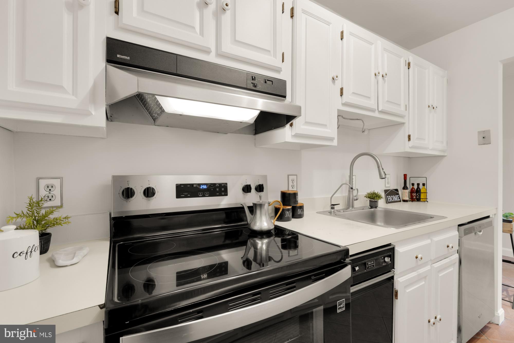 2000 16th Street Northwest, Unit 6 Washington, DC 20009 - Photo 21 of 37 a kitchen with stainless steel appliances a sink stove and cabinets