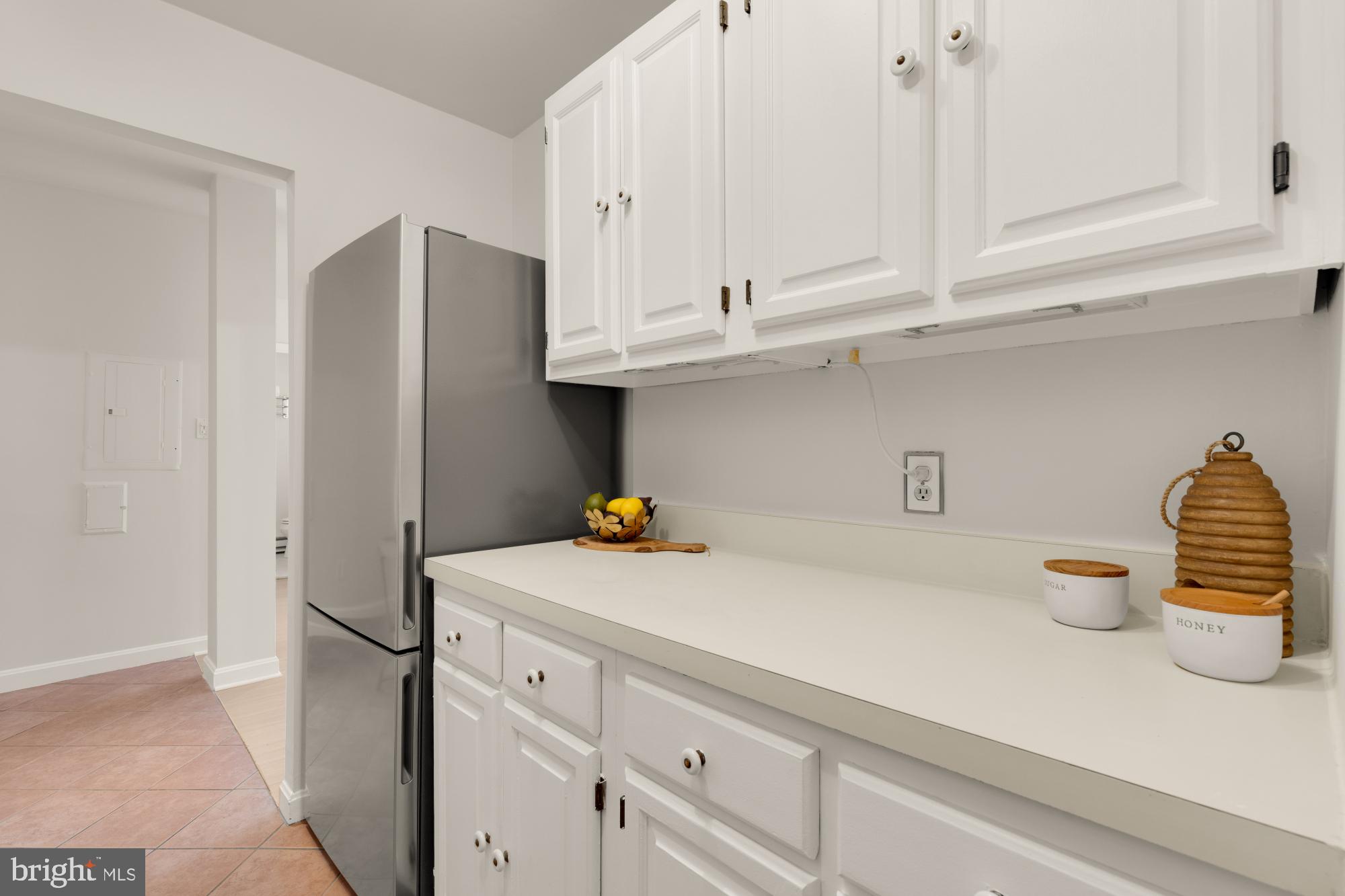 2000 16th Street Northwest, Unit 6 Washington, DC 20009 - Photo 22 of 37 a kitchen with stainless steel appliances white cabinets and a refrigerator