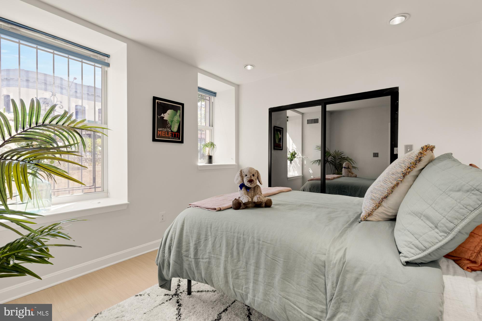 2000 16th Street Northwest, Unit 6 Washington, DC 20009 - Photo 23 of 37 a bedroom with a bed and a window