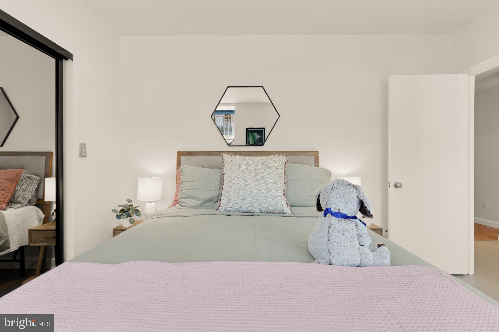 2000 16th Street Northwest, Unit 6 Washington, DC 20009 - Photo 24 of 37 a bedroom with a bed and a mirror