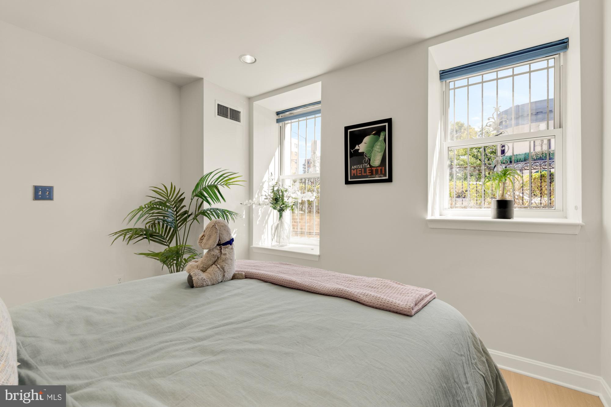 2000 16th Street Northwest, Unit 6 Washington, DC 20009 - Photo 29 of 37 a bedroom with bed and a window