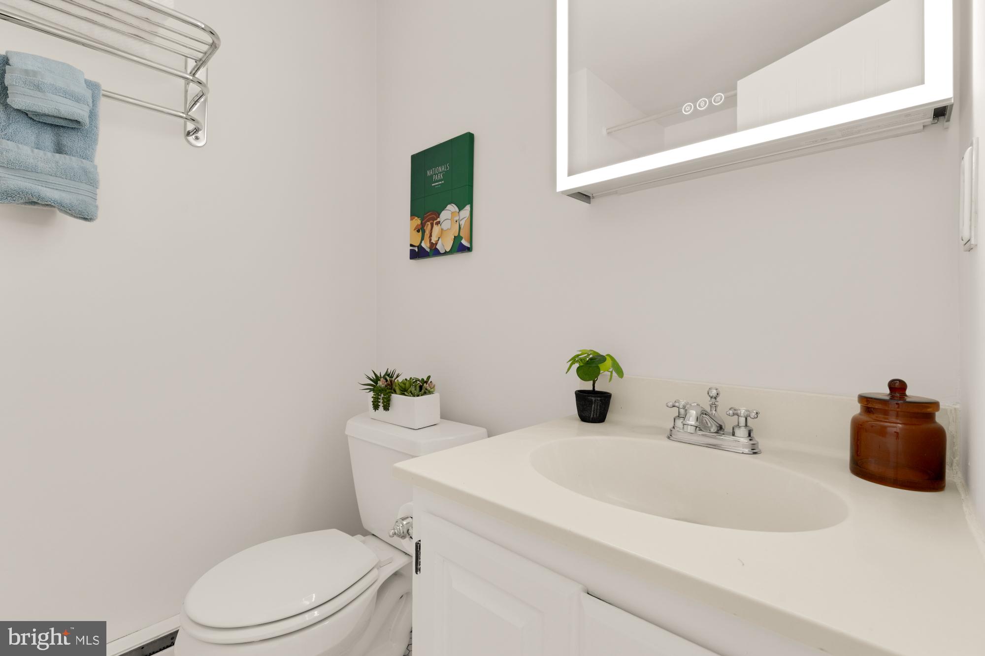 2000 16th Street Northwest, Unit 6 Washington, DC 20009 - Photo 31 of 37 a bathroom with a sink vanity mirror and toilet