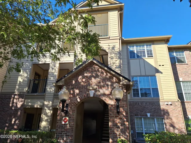 a view of a house with a tree front door