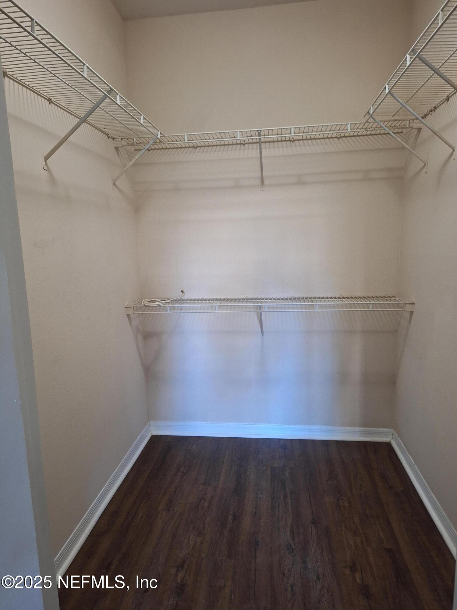 7800 Point Meadows Drive, Unit 116 Jacksonville, FL 32256 - Photo 11 of 29 a view of a room with racks on the wall