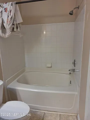 a kitchen with stainless steel appliances granite countertop a refrigerator a sink and a stove