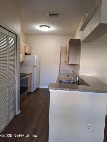 a bathroom with a bath tub with a shower