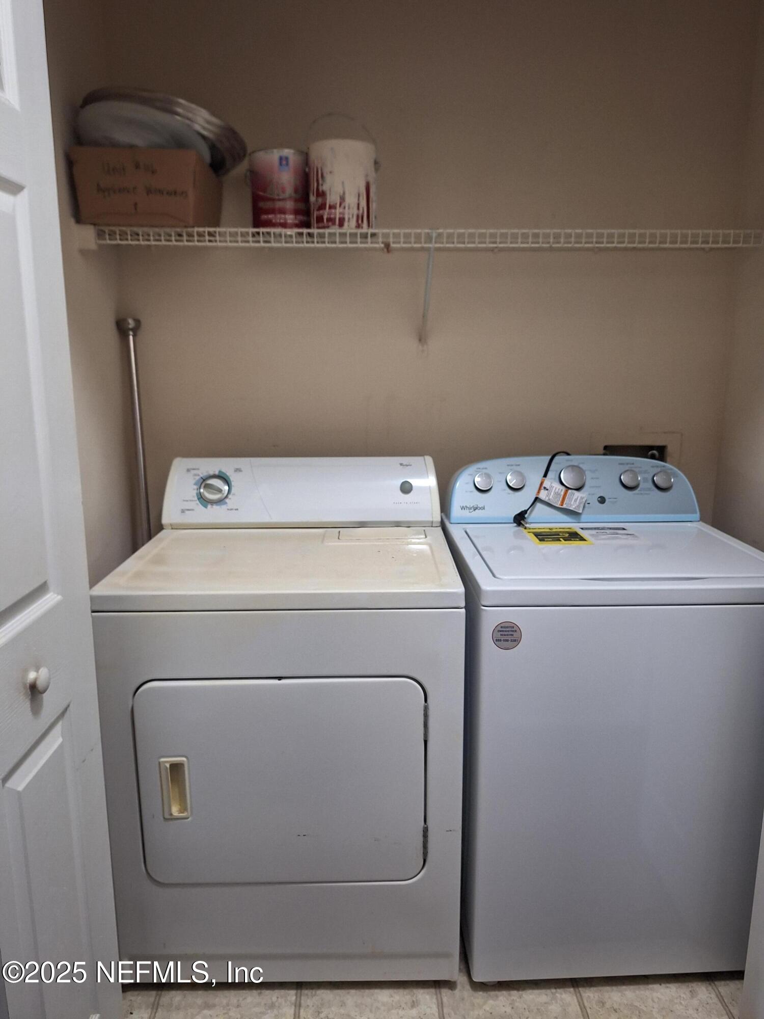 7800 Point Meadows Drive, Unit 116 Jacksonville, FL 32256 - Photo 22 of 29 a utility room with dryer and washer