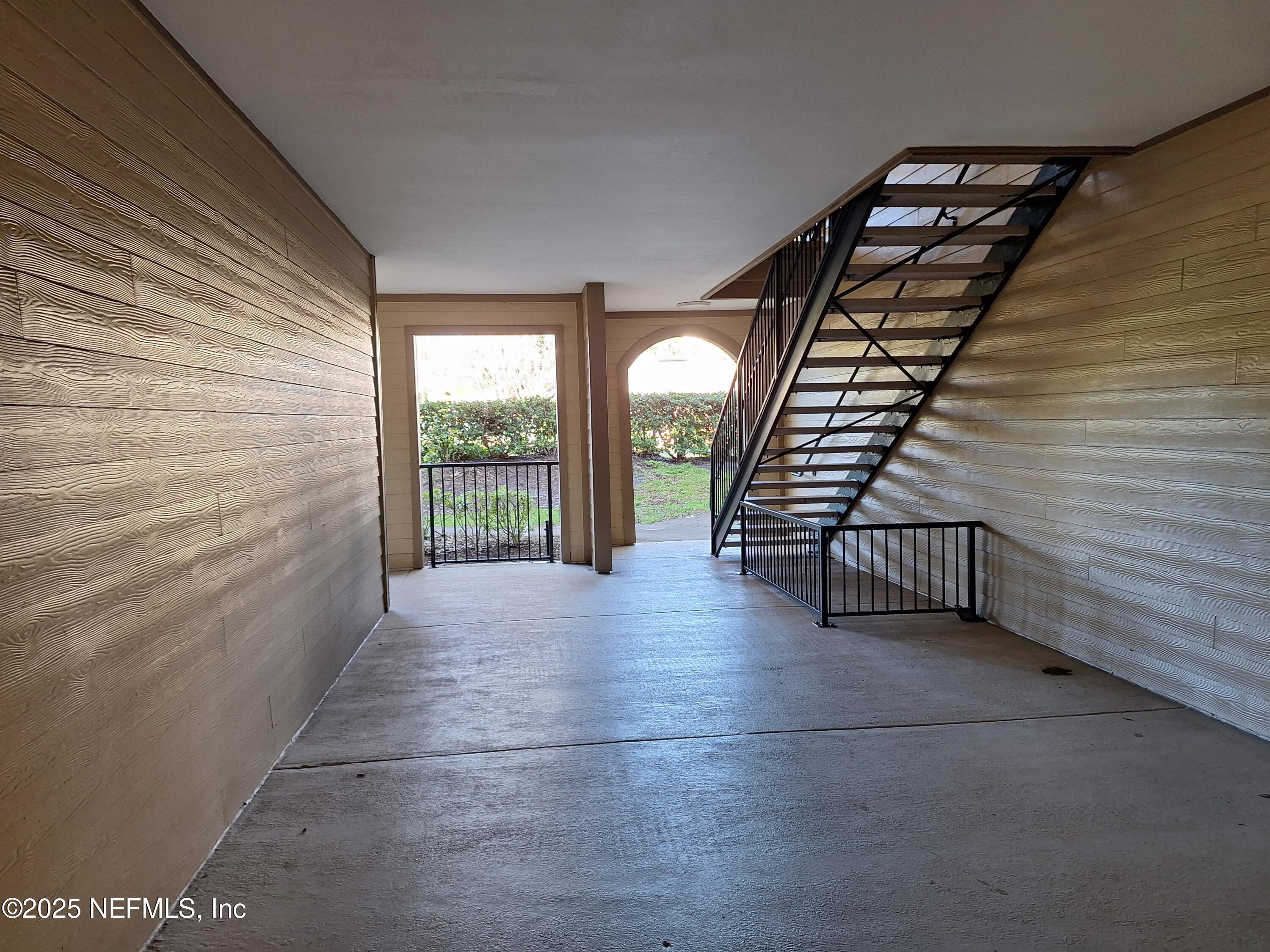 7800 Point Meadows Drive, Unit 116 Jacksonville, FL 32256 - Photo 23 of 29 a view of entryway with wooden floor