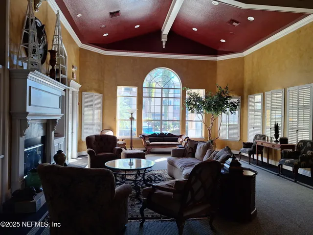a view of hallway with wooden floor and fence