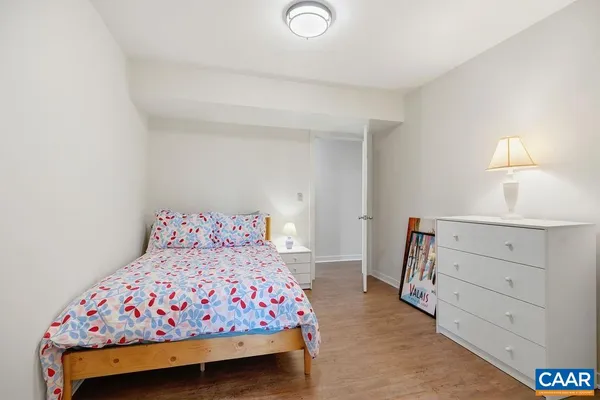 a bedroom with a bed and a dresser