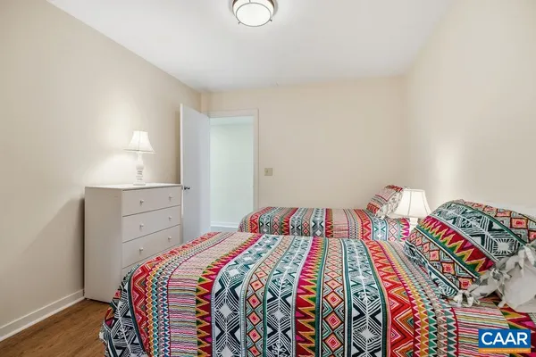 a bedroom with a bed and a dresser