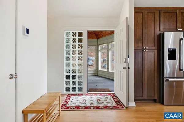 a view of a hallway with a dining area