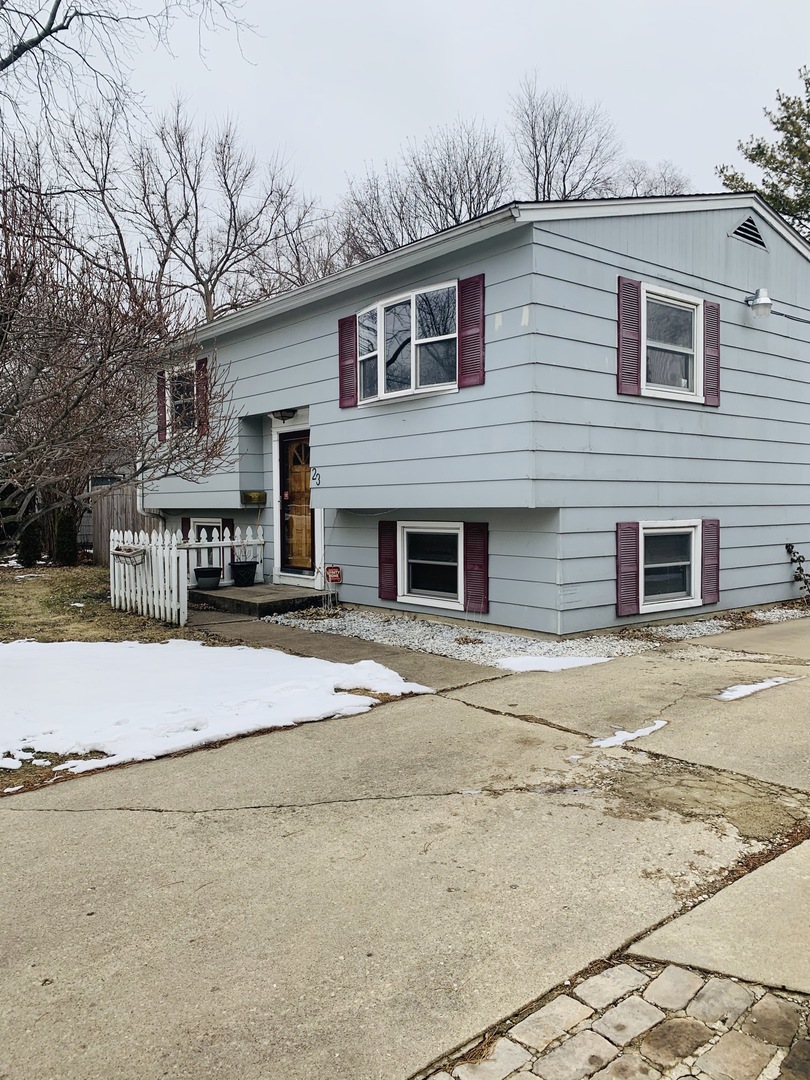23 Surrey Road Montgomery, IL 60538 - Photo 2 of 22 a front view of a house with a yard
