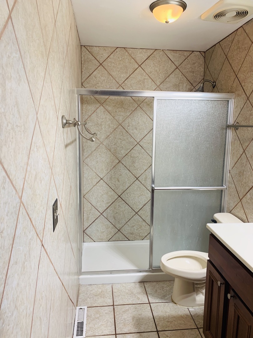 23 Surrey Road Montgomery, IL 60538 - Photo 16 of 22 a white toilet sitting next to a white wall