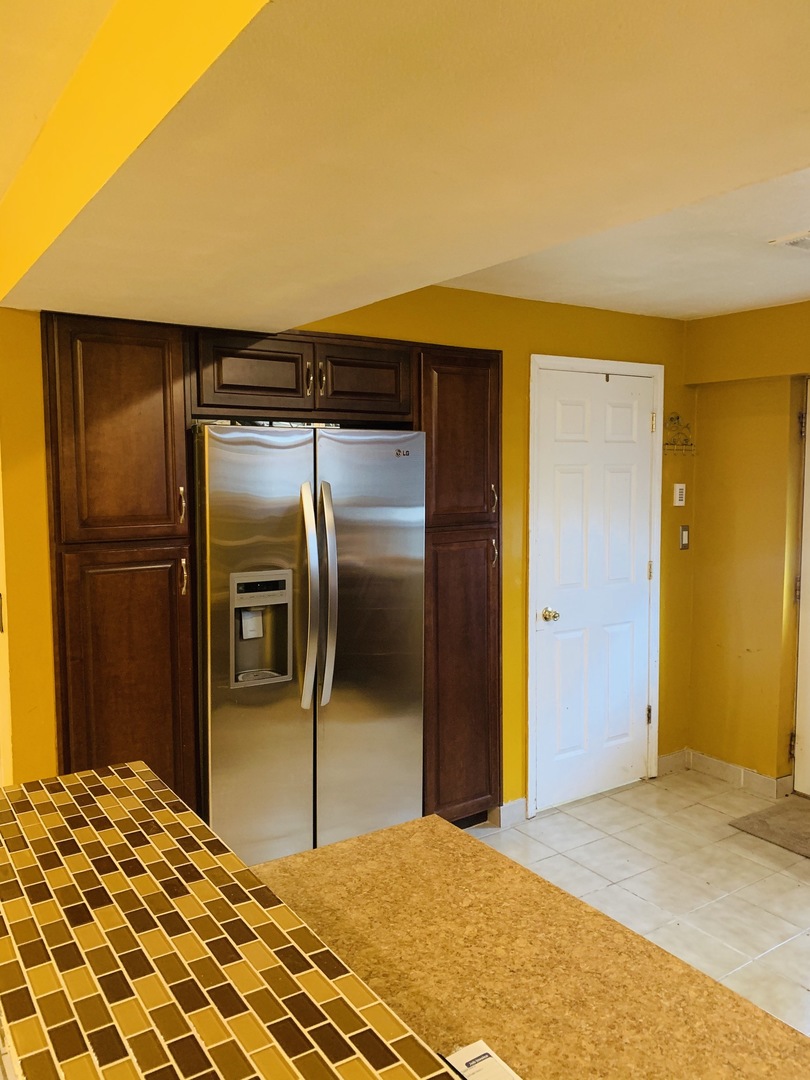 23 Surrey Road Montgomery, IL 60538 - Photo 4 of 22 a view of a hallway with a chandelier
