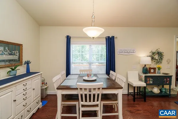 a living room with a bed and a window