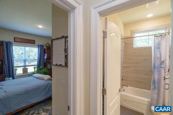 a bath tub sitting next to a white sink