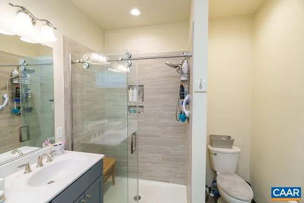 a bedroom with furniture and a book shelf