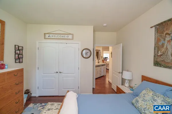 a bedroom with a bed and a view of bedroom