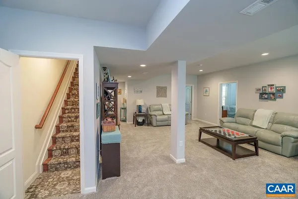 a view of a livingroom with furniture and a window