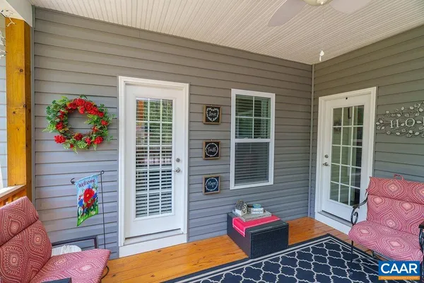 a front view of a house with a yard garage and outdoor seating